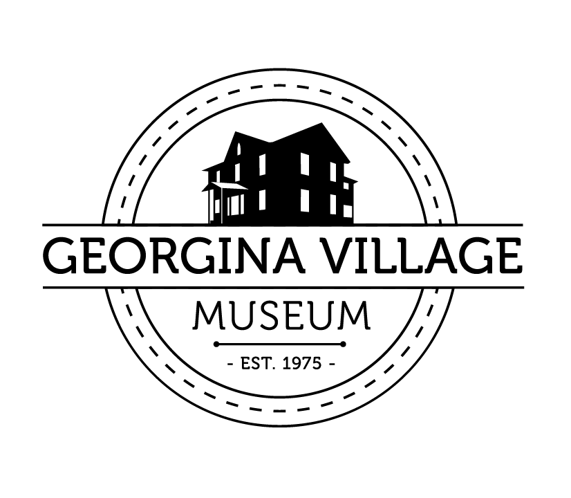 Logo for Georgina Village Museum. A circular badge with a black silhouette of a historic two-storey house at the top. The words 'Georgina Village' appear in bold across the middle, with 'Museum' below and 'Established 1975' at the bottom.