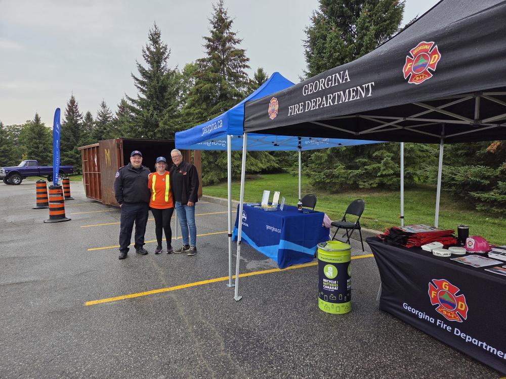 people standing at tents outdoors